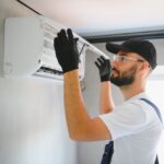 Happy,Male,Technician,Repairing,Air,Conditioner.