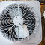 Top,View,Of,Residential,Air,Conditioning,Unit,Outdoors,With,Fan